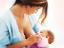 stillende Frau mit Baby